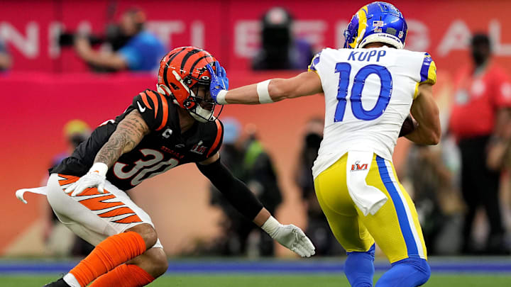 Los Angeles Rams wide receiver Cooper Kupp (10) stiff arms Cincinnati Bengals free safety Jessie Bates (30) after a catch in the first quarter during Super Bowl 56, Sunday, Feb. 13, 2022, at SoFi Stadium in Inglewood, Calif. The Cincinnati Bengals lost, 23-20.

Nfl Super Bowl 56 Los Angeles Rams Vs Cincinnati Bengals Feb 13 2022 0676