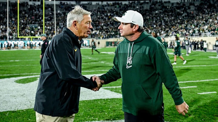 Michigan State's head coach Jonathan Smith, right, shakes hands with Iowa's head coach Kirk Ferentz after the Spartans win on Saturday, Oct. 19, 2024, at Spartan Stadium in East Lansing.