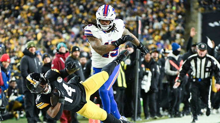 Nov 30, 2025; Pittsburgh, Pennsylvania, USA; Pittsburgh Steelers running back Kenneth Gainwell (14) is tackled out of bounds by Buffalo Bills linebacker Shaq Thompson (45) during the second quarter at Acrisure Stadium. Mandatory Credit: Barry Reeger-Imagn Images