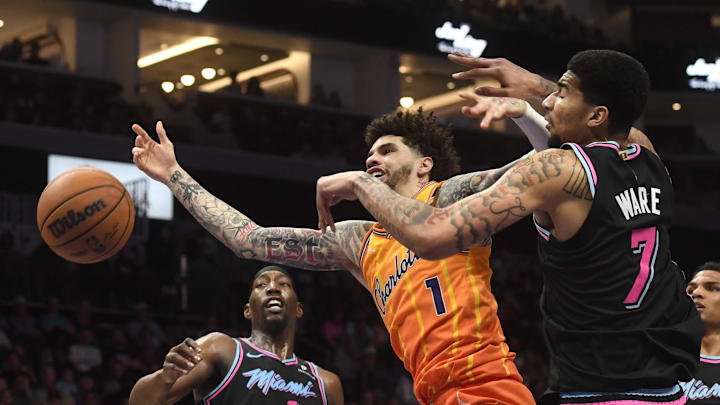 Charlotte Hornets guard LaMelo Ball (1) drives in against Miami Heat center Kel’el Ware 