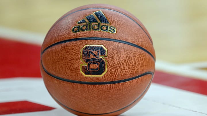 Feb 20, 2019; Raleigh, NC, USA; Basketball with the North Carolina State Wolfpack logo sits on the court during a timeout as the Wolfpack play the Boston College Eagles in the first half at PNC Arena. The North Carolina State Wolfpack won 89-80. Mandatory Credit: Nell Redmond-Imagn Images