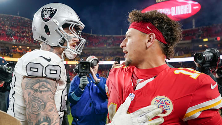 Nov 29, 2024; Kansas City, Missouri, USA; Kansas City Chiefs quarterback Patrick Mahomes (15) greets Las Vegas Raiders defensive end Maxx Crosby (98) after the game at GEHA Field at Arrowhead Stadium. Mandatory Credit: Denny Medley-Imagn Images