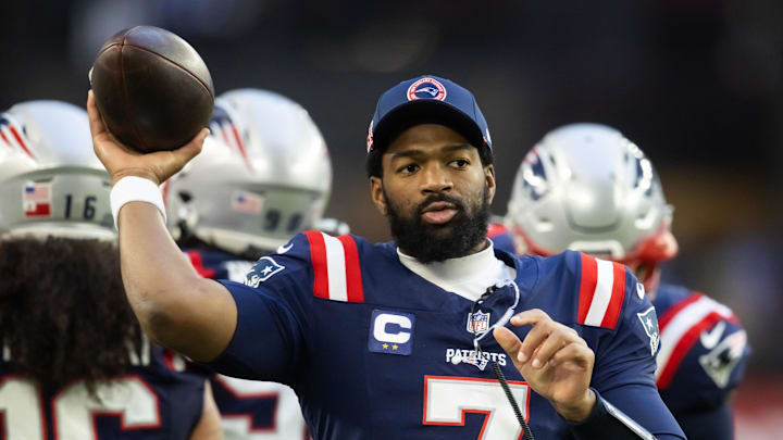 New England Patriots quarterback Jacoby Brissett warms up for a game.