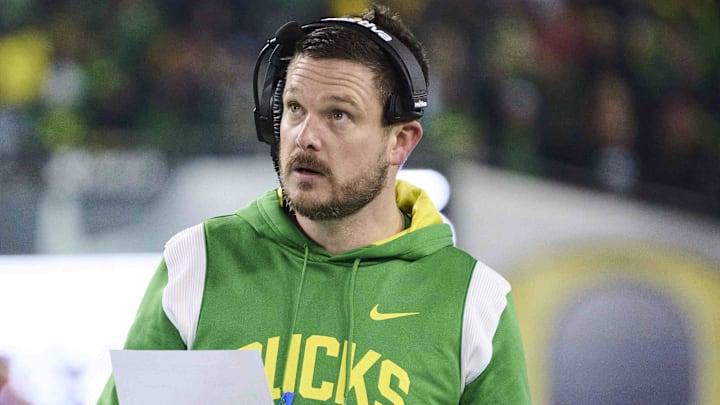 Nov 19, 2022; Eugene, Oregon, USA; Oregon Ducks head coach Dan Lanning looks up while going through game notes during the first half against the Utah Utes at Autzen Stadium. Mandatory Credit: Troy Wayrynen-Imagn Images