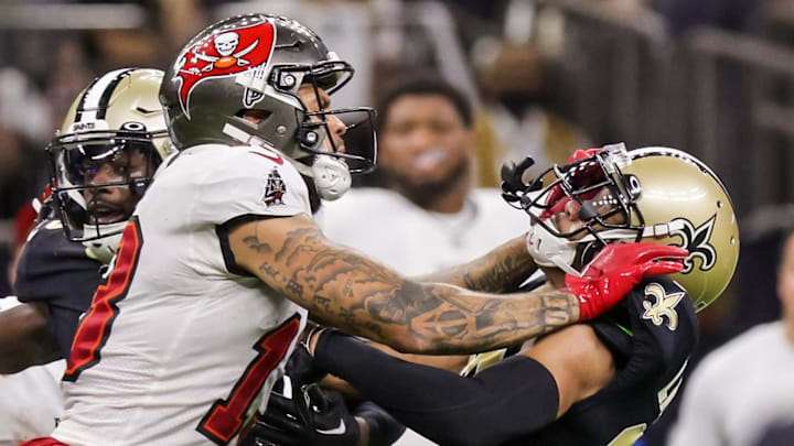 Sep 18, 2022; New Orleans, Louisiana, USA;  New Orleans Saints cornerback Marshon Lattimore (23) and safety Marcus Maye (6) get into a penalty with Tampa Bay Buccaneers wide receiver Mike Evans (13) and they are ejected after the play during the second half at Caesars Superdome. Mandatory Credit: Stephen Lew-Imagn Images