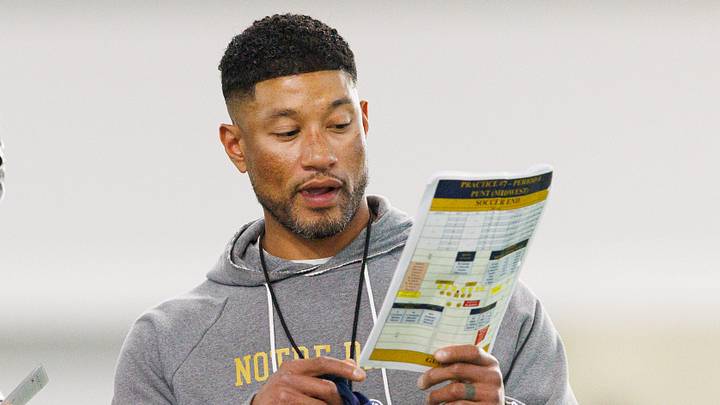 Head coach Marcus Freeman, right, speaks to a group of players during a Notre Dame football practice at Irish Athletic Center on Wednesday, April 8, 2026, in South Bend.