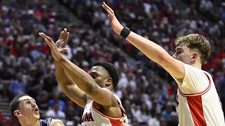 Mar 22, 2026; San Diego, CA, USA; Utah State Aggies guard Drake Allen (8) controls the ball against Arizona Wildcats forward Tobe Awaka (30) in the first half during a second round game of the men's 2026 NCAA Tournament at Viejas Arena. Mandatory Credit: Denis Poroy-Imagn Images