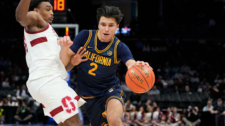 Mar 12, 2025; Charlotte, NC, USA; California Golden Bears guard Andrej Stojakovic (2) with the ball as Stanford Cardinal guard Jaylen Blakes (21) defends in the second half at Spectrum Center. Mandatory Credit: Bob Donnan-Imagn Images