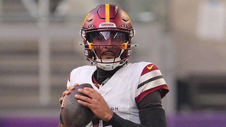 Dec 7, 2025; Minneapolis, Minnesota, USA; Washington Commanders quarterback Jayden Daniels (5) drops back to pass against the Minnesota Vikings during the first half at U.S. Bank Stadium. Mandatory Credit: Brad Rempel-Imagn Images