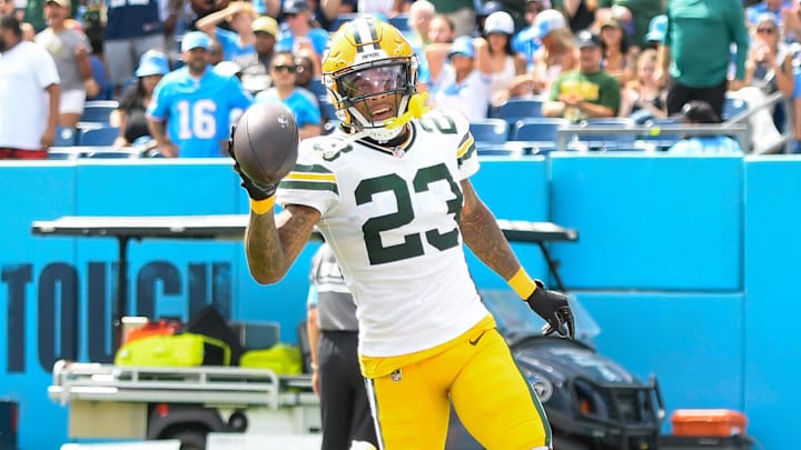 Sep 22, 2024; Nashville, Tennessee, USA;  Green Bay Packers cornerback Jaire Alexander (23) scores on a pick six thrown by Tennessee Titans Will Levis (8) during the first half at Nissan Stadium. Mandatory Credit: Steve Roberts-Imagn Images