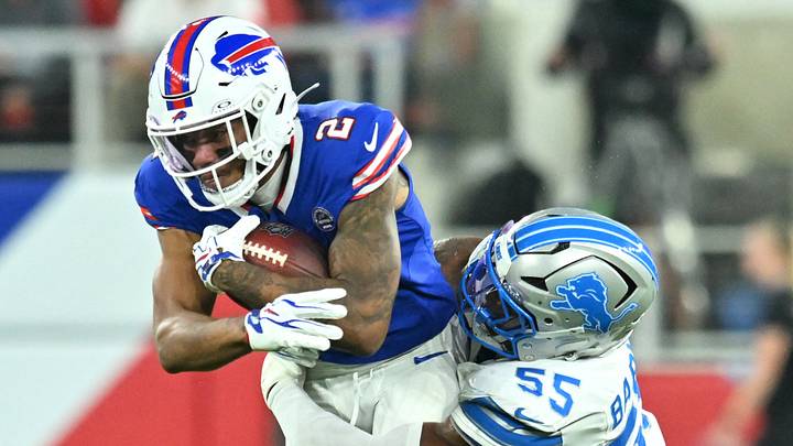 Sep 17, 2026; Orchard Park, New York, USA;  Detroit Lions linebacker Derrick Barnes (55) tackles Buffalo Bills wide receiver DJ Moore (2) during the first half at New Highmark Stadium.  Mandatory Credit: Mark Konezny-Imagn Images