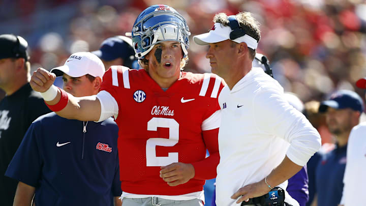 Sep 7, 2024; Oxford, Mississippi, USA; Mississippi Rebels quarterback Jaxson Dart (2) talks with Mississippi Rebels head coach Lane Kiffin during the first half against the Middle Tennessee Blue Raiders at Vaught-Hemingway Stadium. Mandatory Credit: Petre Thomas-Imagn Images