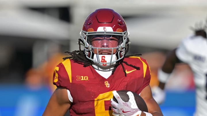 Sep 6, 2025; Los Angeles, California, USA;  USC Trojans wide receiver Makai Lemon (6) runs down field for a touchdown on a pass play during the first half against the Georgia Southern Eaglesat Los Angeles Memorial Coliseum. Mandatory Credit: Jayne Kamin-Oncea-Imagn Images