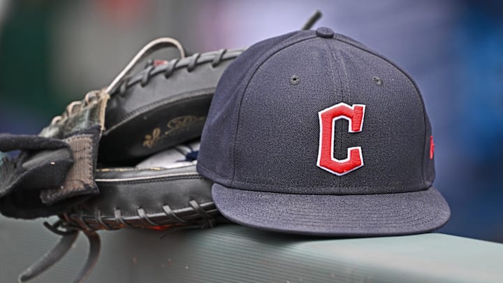 Jun 27, 2024; Kansas City, Missouri, USA; A general view a Cleveland Guardians hat and glove on the dugout railing before a game against the Kansas City Royals at Kauffman Stadium. Mandatory Credit: Peter Aiken-Imagn Images Jun 27, 2024; Kansas City, Missouri, USA; A general view a Cleveland Guardians hat and glove on the dugout railing before a game against the Kansas City Royals at Kauffman Stadium. Mandatory Credit: Peter Aiken-Imagn Images
