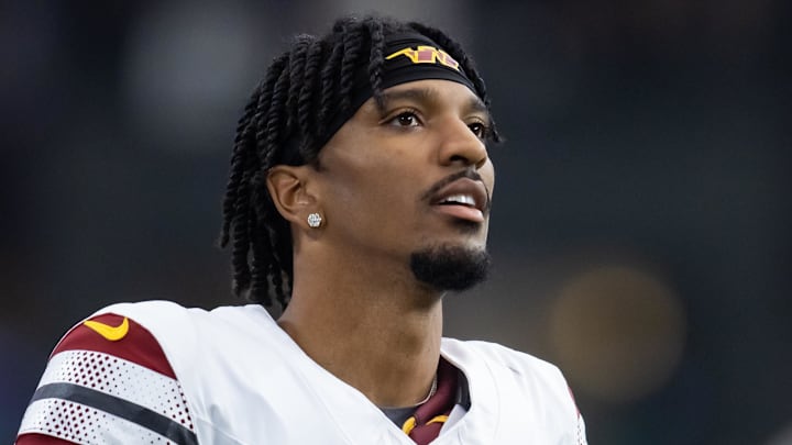 Washington Commanders quarterback Jayden Daniels (5) against the Arizona Cardinals at State Farm Stadium. Mandatory Credit: Mark J. Rebilas-Imagn Images