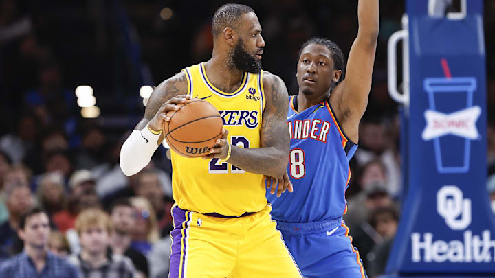 Nov 30, 2023; Oklahoma City, Oklahoma, USA; Oklahoma City Thunder forward Jalen Williams (8) defends a play by Los Angeles Lakers forward LeBron James (23) during the second half at Paycom Center. Mandatory Credit: Alonzo Adams-Imagn Images