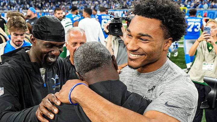 New York Jets head coach Aaron Glenn, center, hugs Detroit Lions safety Kerby Joseph (31), left, defensive back Brian Branch (32) New York Jets head coach Aaron Glenn, center, hugs Detroit Lions safety Kerby Joseph (31), left, defensive back Brian Branch (32)