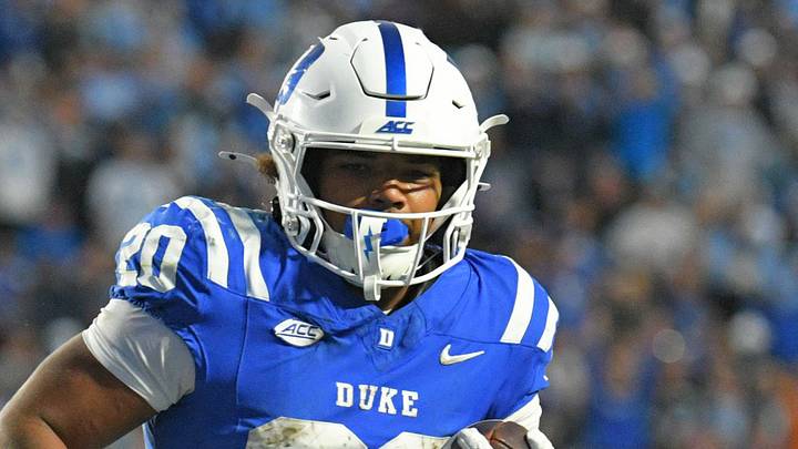 Oct 17, 2026; Durham, North Carolina, USA;  Duke Blue Devils running back Nate Sheppard (20) brings the ball into the end zone against North Carolina Tar Heels defensive back Kenton Dopson III (21) during the fourth quarter at Wallace Wade Stadium.  Mandatory Credit: Zachary Taft-Imagn Images