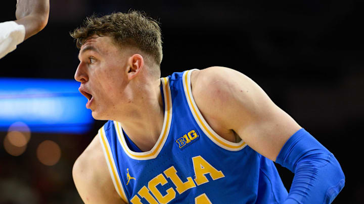 Jan 10, 2025; College Park, Maryland, USA; UCLA Bruins forward Tyler Bilodeau (34) handles the ball against Maryland Terrapins center Derik Queen (25) during the first half at Xfinity Center. Mandatory Credit: Reggie Hildred-Imagn Images Jan 10, 2025; College Park, Maryland, USA; UCLA Bruins forward Tyler Bilodeau (34) handles the ball against Maryland Terrapins center Derik Queen (25) during the first half at Xfinity Center. Mandatory Credit: Reggie Hildred-Imagn Images