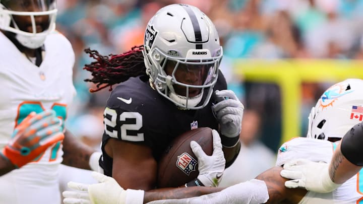 Nov 17, 2024; Miami Gardens, Florida, USA; Las Vegas Raiders running back Alexander Mattison (22) runs with the football against the Miami Dolphins during the third quarter at Hard Rock Stadium. Mandatory Credit: Sam Navarro-Imagn Images