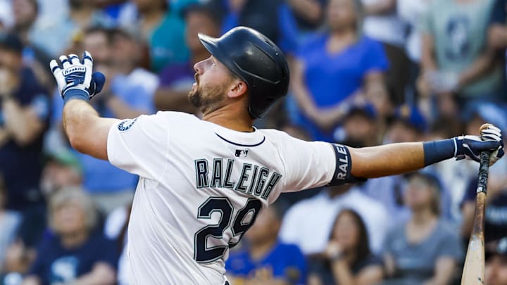 Seattle Mariners catcher Cal Raleigh (29) hits an RBI-sacrifice fly against the Kansas City Royals during the fifth inning at T-Mobile Park on June 30. 