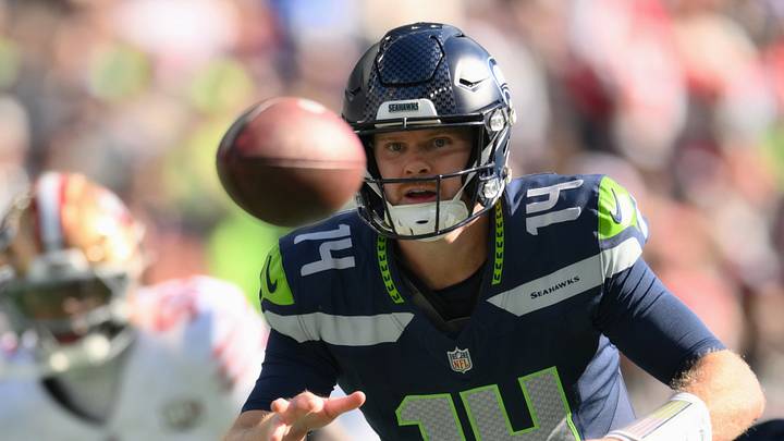Oct 11, 2026; Seattle, Washington, USA; Seattle Seahawks quarterback Sam Darnold (14) pitches the ball to running back Emanuel Wilson (23) against the San Francisco 49ers during the first half at Lumen Field. Mandatory Credit: Steven Bisig-Imagn Images Oct 11, 2026; Seattle, Washington, USA; Seattle Seahawks quarterback Sam Darnold (14) pitches the ball to running back Emanuel Wilson (23) against the San Francisco 49ers during the first half at Lumen Field. Mandatory Credit: Steven Bisig-Imagn Images