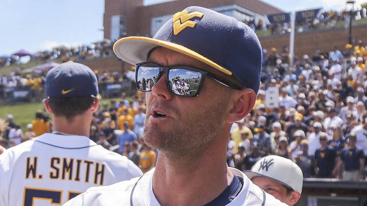 Jun 5, 2026; Morgantown, WV, USA; West Virginia Mountaineers head coach Steve Sabins celebrates with his team after defeating the Cal Poly Mustangs at Kendrick Family Ballpark. Mandatory Credit: Ben Queen-Imagn Images