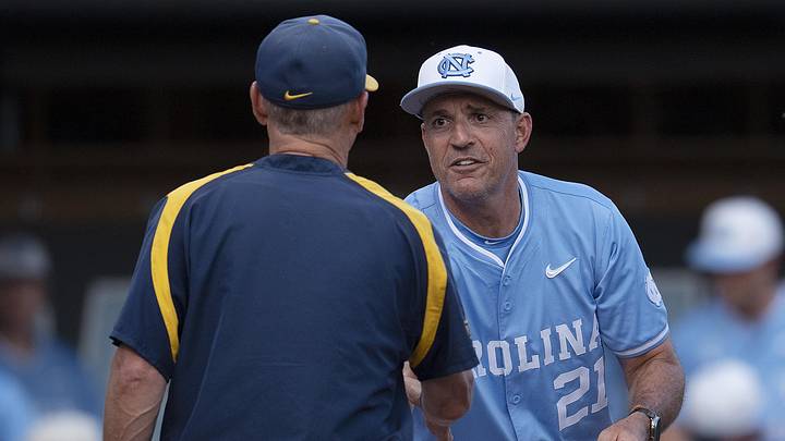 Jun 8, 2024; Chapel Hill, NC, USA; North Carolina Tar Heels head coach Scott Forbes (21) shakes hands with West Virginia Mountaineers Randy Mazey prior to the DI Baseball Super Regional at Boshamer Stadium. Mandatory Credit: Jeffrey Camarati-Imagn Images
Jun 8, 2024; Chapel Hill, NC, USA; North Carolina Tar Heels head coach Scott Forbes (21) shakes hands with West Virginia Mountaineers Randy Mazey prior to the DI Baseball Super Regional at Boshamer Stadium. Mandatory Credit: Jeffrey Camarati-Imagn Images
