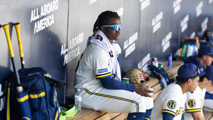 Feb 27, 2026; Phoenix, Arizona, USA; Milwaukee Brewers infielder Jesus Made sits in the dugout against the Chicago White Sox during a spring training game at American Family Fields of Phoenix. Mandatory Credit: Mark J. Rebilas-Imagn Images