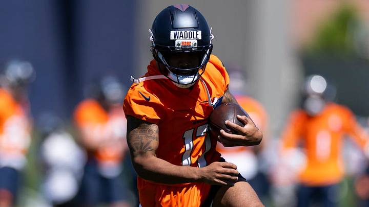 Denver Broncos wide receiver Jaylen Waddle catches a pass during OTA practice at Broncos Park Powered by CommonSpirit. Denver Broncos wide receiver Jaylen Waddle catches a pass during OTA practice at Broncos Park Powered by CommonSpirit.