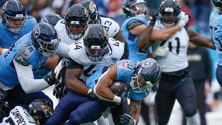 Tennessee Titans running back Tony Pollard (20) gets a first down during the first quarter at Nissan Stadium in Nashville, Tenn., Sunday, Dec. 8, 2024. Tennessee Titans running back Tony Pollard (20) gets a first down during the first quarter at Nissan Stadium in Nashville, Tenn., Sunday, Dec. 8, 2024.