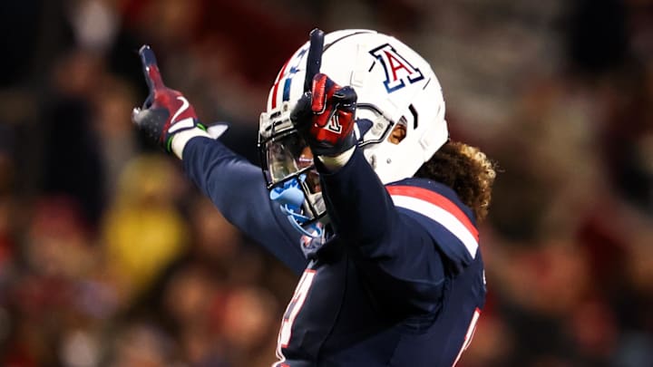 Nov 15, 2024; Tucson, Arizona, USA; Arizona Wildcats defensive back Genesis Smith (12) celebrates a blocked catch during the third quarter against the Houston Cougars at Arizona Stadium. Mandatory Credit: Aryanna Frank-Imagn Images