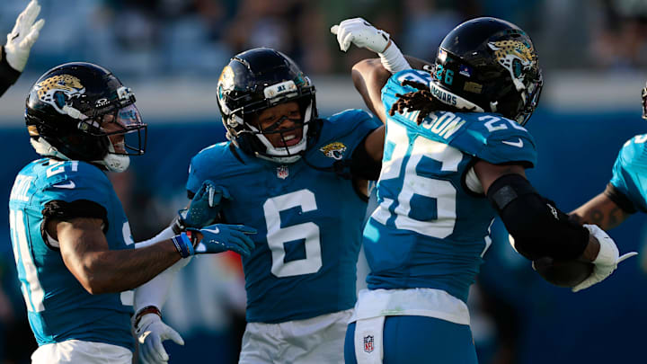 Jacksonville Jaguars cornerback Greg Newsome II (6) high-fives safety Antonio Johnson (26) for his interception during the fourth quarter of an NFL football matchup at EverBank Stadium, Sunday, Dec. 14, 2025, in Jacksonville, Fla. The Jaguars defeated the Jets 48-20. [Corey Perrine/Florida Times-Union]