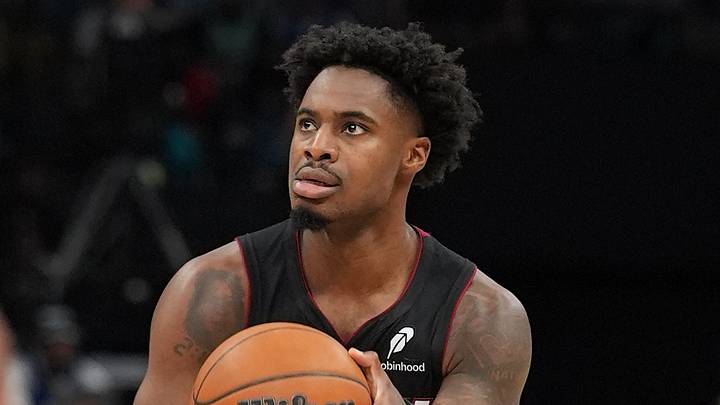 Apr 14, 2026; Charlotte, North Carolina, USA; Miami Heat guard Davion Mitchell (45) shoots the ball against the Charlotte Hornets during the second quarter during the play-in rounds between the Charlotte Hornets and the Miami Heat of the 2026 NBA Playoffs at Spectrum Center. Mandatory Credit: Jim Dedmon-Imagn Images