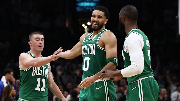 Mar 6, 2026; Boston, Massachusetts, USA; Boston Celtics forward Jayson Tatum (0) smiles at Boston Celtics guard Jaylen Brown (7) while being congratulated by guard Payton Pritchard (11) during the second half at TD Garden. Mandatory Credit: Winslow Townson-Imagn Images