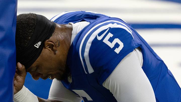 Indianapolis Colts quarterback Anthony Richardson Sr. kneels before a game