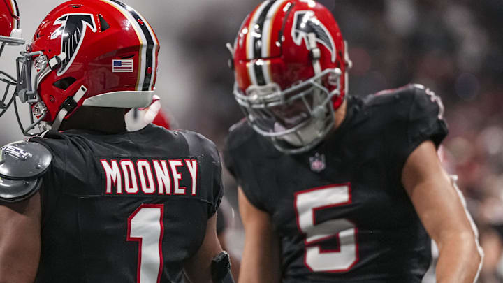 Atlanta Falcons wide receivers Darnell Mooney (1) and Drake London (5) are close to reaching the 1,000-yard mark. Atlanta Falcons wide receivers Darnell Mooney (1) and Drake London (5) are close to reaching the 1,000-yard mark.