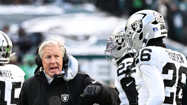 Dec 14, 2025; Philadelphia, Pennsylvania, USA; Las Vegas Raiders Head Coach Pete Carroll talks with players on the sidelines during the first quarter against the Philadelphia Eagles at Lincoln Financial Field. Mandatory Credit: Eric Hartline-Imagn Images