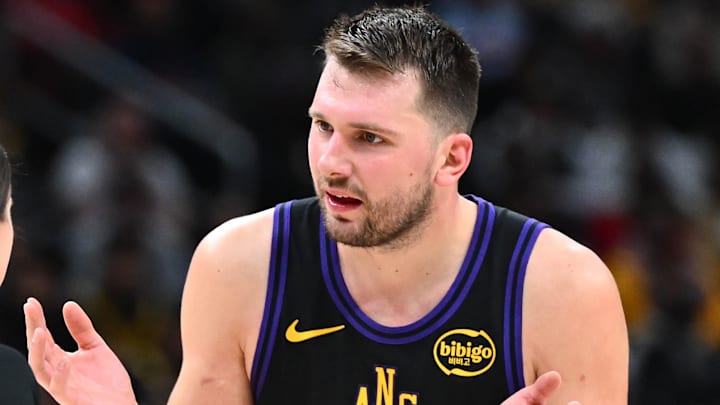 Jan 30, 2026; Washington, District of Columbia, USA; Los Angeles Lakers forward/guard Luka Doncic (77) talks with referee Natalie Sago (9) during the second half at Capital One Arena. Mandatory Credit: Brad Mills-Imagn Images