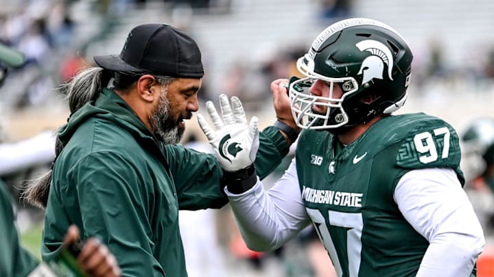 Michigan State's Maverick Hansen, right, works with defensive line coach Legi Suiaunoa during the Spring Showcase on Saturday, April 20, 2024, at Spartan Stadium in East Lansing.