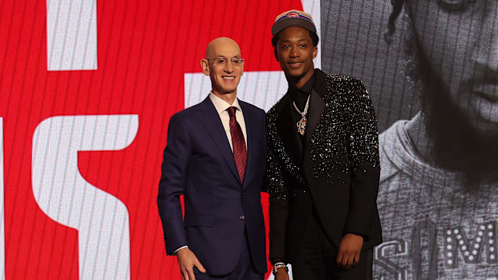 Jun 26, 2024; Brooklyn, NY, USA; Ron Holland II poses for photos with NBA commissioner Adam Silver after being selected in the first round by the Detroit Pistons in the 2024 NBA Draft at Barclays Center. Mandatory Credit: Brad Penner-Imagn Images