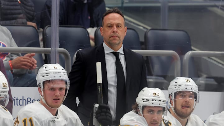Nov 4, 2025; Elmont, New York, USA; Boston Bruins head coach Marco Sturm coaches against the New York Islanders during the first period at UBS Arena. Mandatory Credit: Brad Penner-Imagn Images