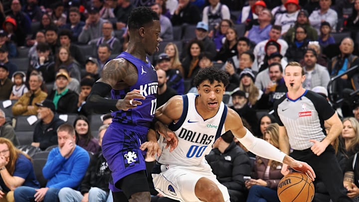 Dec 27, 2025; Sacramento, California, USA; Dallas Mavericks guard Max Christie (00) controls the ball against Sacramento Kings guard Dennis Schroder (17) during the second quarter at Golden 1 Center. Mandatory Credit: Kelley L Cox-Imagn Images