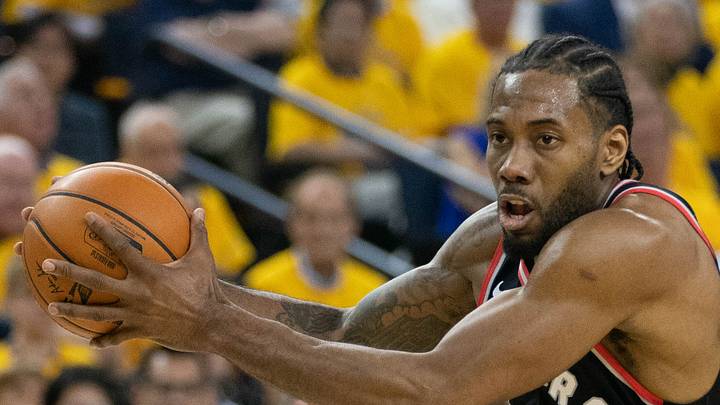 Toronto Raptors forward Kawhi Leonard drives to the basket against Golden State Warriors forward Alfonzo McKinnie. Toronto Raptors forward Kawhi Leonard drives to the basket against Golden State Warriors forward Alfonzo McKinnie.