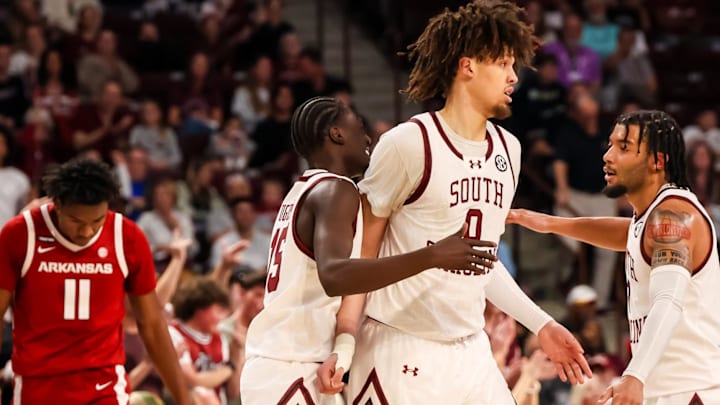 South Carolina Gamecocks guard Morris Ugusuk (15), forward Jordan Butler (0) and guard Jacobi Wright (1) celebrate a play against the Arkansas Razorbacks in the second half at Colonial Life Arena. 