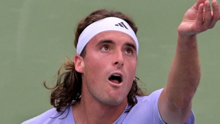 Stefanos Tsitsipas serves during a match
