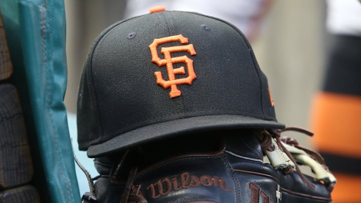Jul 14, 2023; Pittsburgh, Pennsylvania, USA;  San Francisco Giants hat and glove on the bench against the Pittsburgh Pirates during the first inning at PNC Park. 