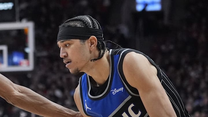 Orlando Magic guard Anthony Black tries to dribble around Toronto Raptors guard Ja'Kobe Walter. Orlando Magic guard Anthony Black tries to dribble around Toronto Raptors guard Ja'Kobe Walter.