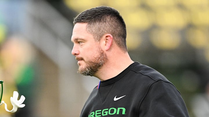 Dec 20, 2025; Eugene, OR, USA; Oregon Ducks head coach Dan Lanning greets Oregon Ducks running back Jordon Davison (0) before the game against the James Madison Dukes at Autzen Stadium. 