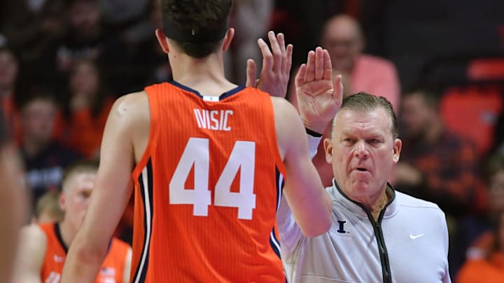 Nov 24, 2025; Champaign, Illinois, USA; Illinois Fighting Illini head coach Brad Underwood gives player Illinois Fighting Illini forward Zvonimir Ivisic (44) a hand during the first half against the UT Rio Grande Valley Vaqueros at State Farm Center. Mandatory Credit: Ron Johnson-Imagn Images Nov 24, 2025; Champaign, Illinois, USA; Illinois Fighting Illini head coach Brad Underwood gives player Illinois Fighting Illini forward Zvonimir Ivisic (44) a hand during the first half against the UT Rio Grande Valley Vaqueros at State Farm Center. Mandatory Credit: Ron Johnson-Imagn Images